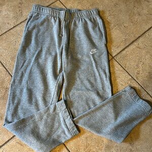Nike gray sweatpants. Two side pockets and back pocket with snap closure. Size S